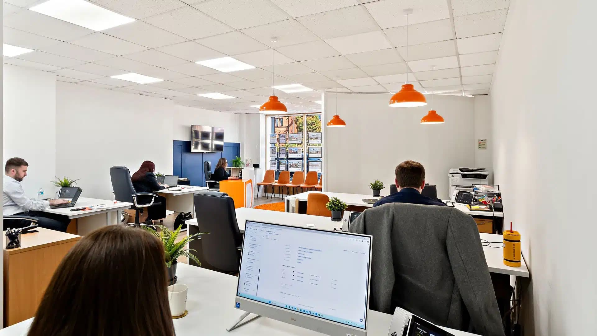 An office in Renfrew with staff working on their jobs